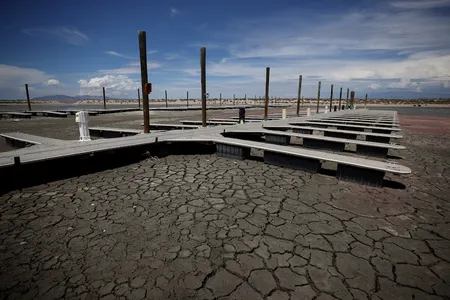 Boat docks sit on dry, cracked earth at the Great Salt Lake&#39;s Antelope Island Marina on August 1, 2021.