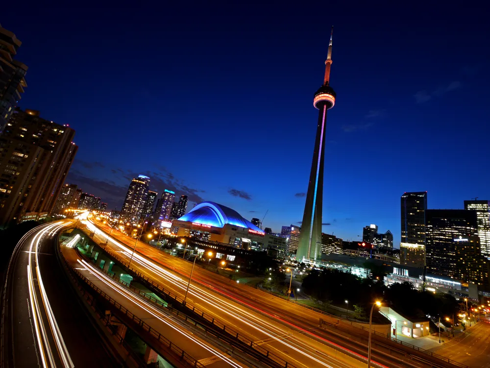 OPENER - More than 1,800 feet high, the CN Tower, a communications hub and tourist attraction, pierces the night sky just after dusk in downtown Toronto.