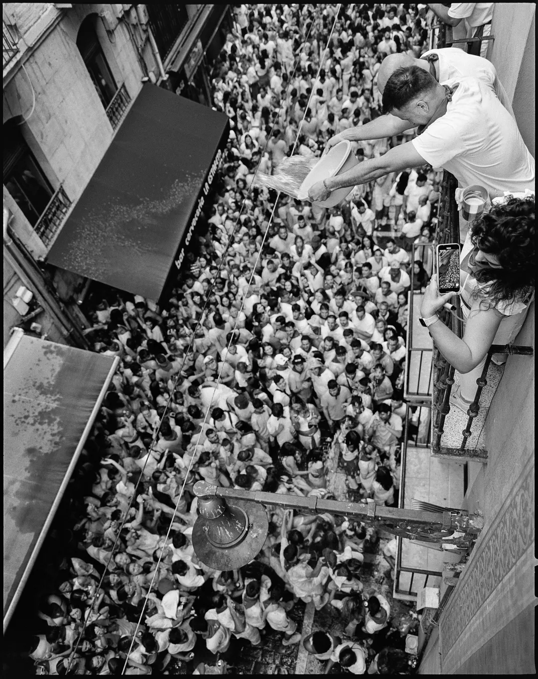 Partiers cram a Pamplona street during the Festival of San Fermín last summer,