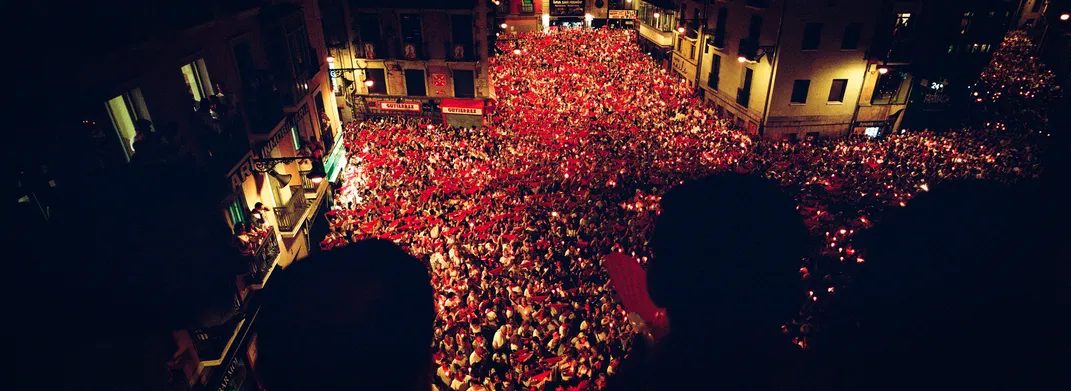 Thousands gather at midnight on July 14 in the Plaza Consistorial for the candlelight singing of “Pobre de Mí” (“Poor Me”), the closing ceremony of the festival.