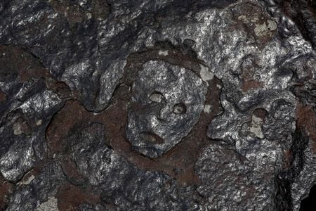 A historic drought in the Amazon has revealed faces carved in the rocky banks of the Rio Negro in Brazil.