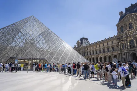 The Louvre&#39;s current visitor entrance is underneath a pyramid designed by I.M. Pei in the Napol&eacute;on courtyard.