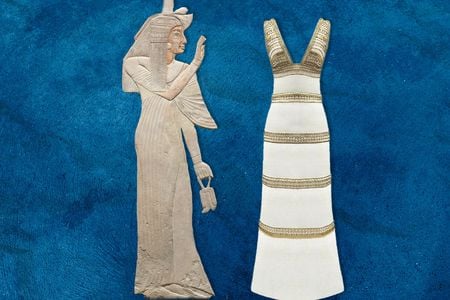 In an exhibition on ancient Egyptian-inspired fashion at the Cleveland Museum of Art, a relief depicts the wife of Amenhotep wearing a&nbsp;kalasiris, or long linen dress, juxtaposed with a white jersey gown designed by Karl Lagerfeld in 2019.