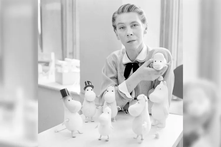 Tove Jansson with several Moomin dolls