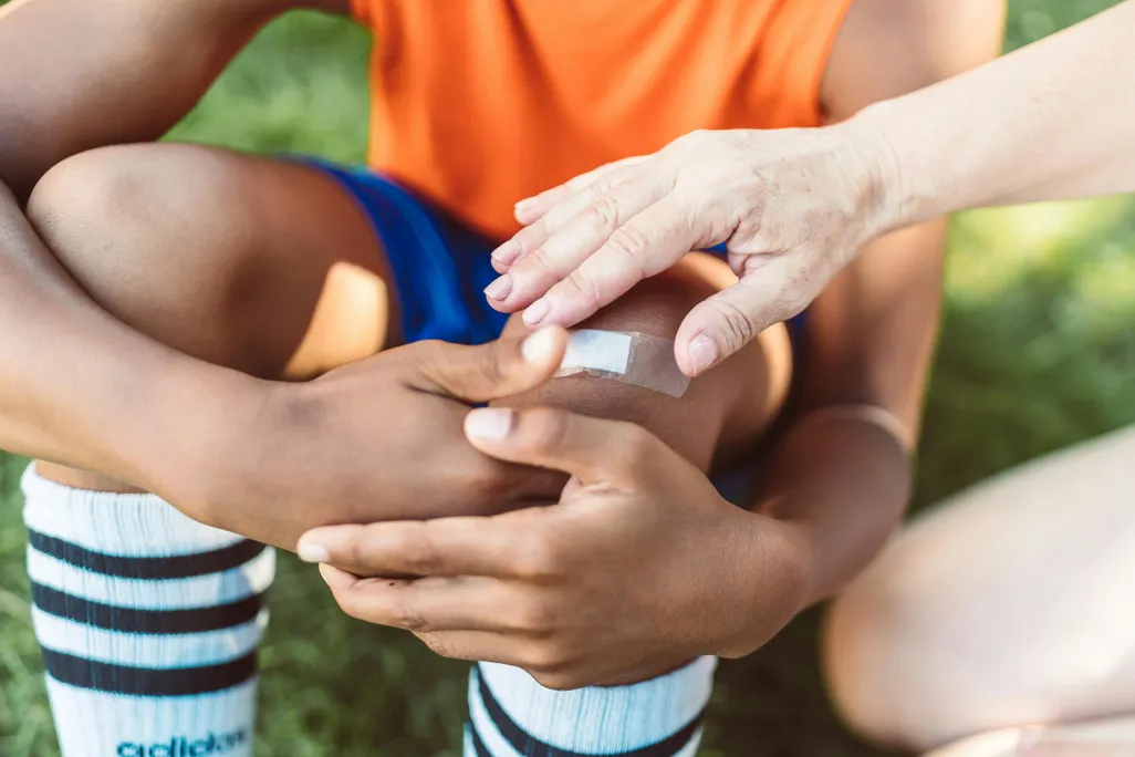 Child with bandage on knee
