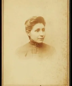 Black and white portrait of Susan La Flesche Picotte on a photo card from the shoulders up.