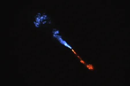 An image from the ALMA telescope array in Chile shows jets of silicon monoxide blowing away from the young star HOPS-315. The blue jet is moving towards Earth, and the red jet is moving away from us.